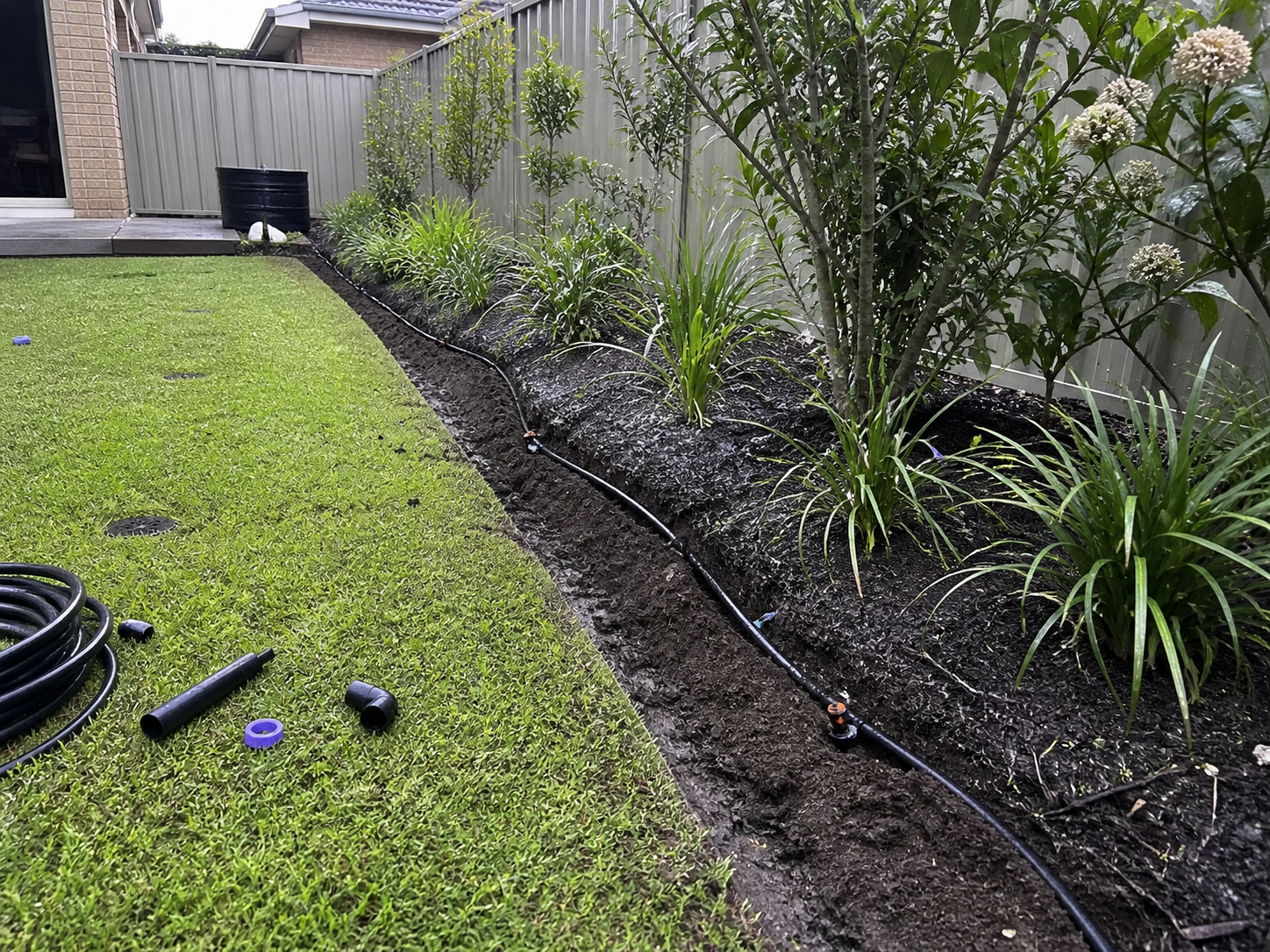 Irrigation and automated watering system installation in Melbourne garden, installed by Mow It Up lawn specialists